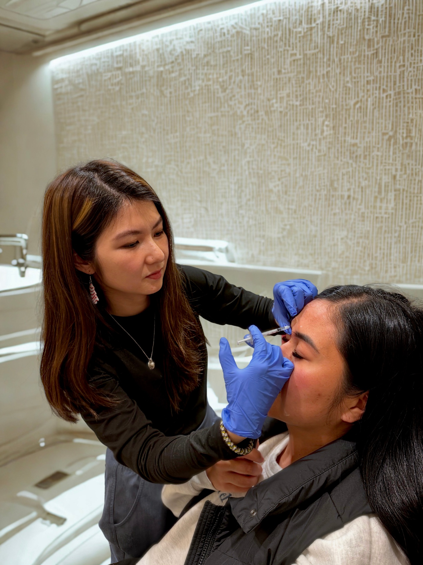 Vann Luong, PA-C performing an injectable treatment at Organic Skin Studio
